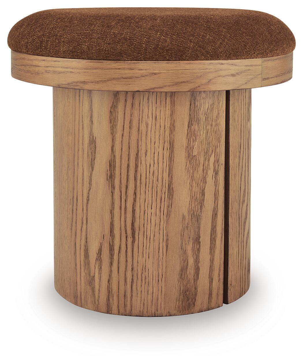 Round accent ottoman with brown fabric top and light wood cylindrical base