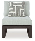 Outdoor sectional chair seat with light gray back cushion, geometric pillow, black frame