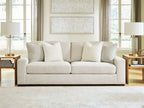 Conlee-Pike linen sofa in light beige with multiple throw pillows and black legs