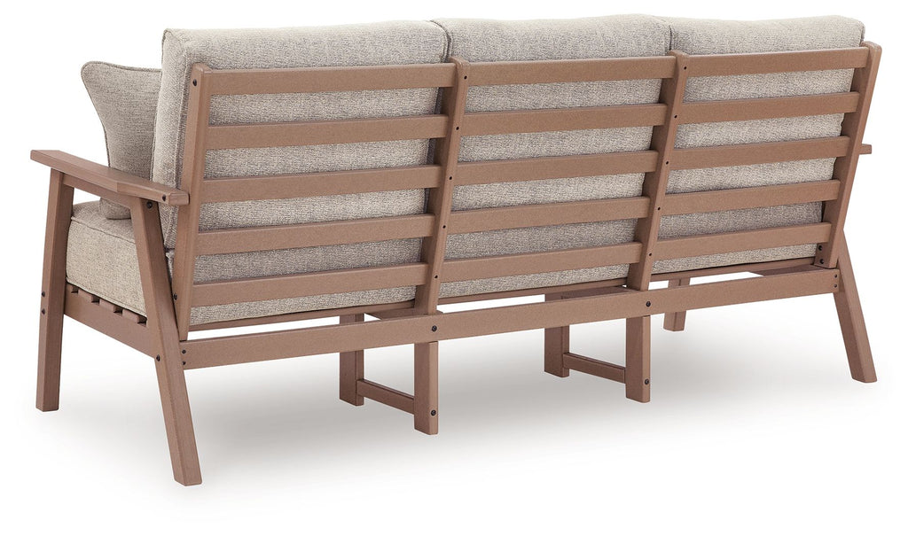 Gray outdoor sofa back with driftwood slatted frame and two throw pillows