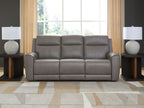 Power reclining sofa with adjustable headrests, light gray upholstery, three seat back panels