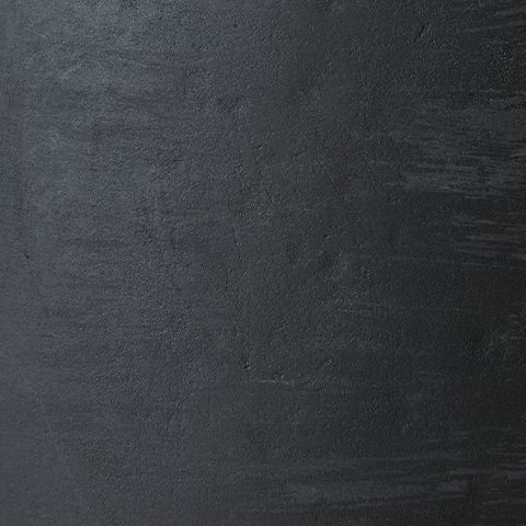 Distressed black paper lamp finish with textured, rubbed surface grain