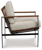 Tilden accent chair with ivory cushion, brown arms, and black metal base