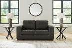 Dark brown loveseat with two-seat sofa back and rounded padded armrests