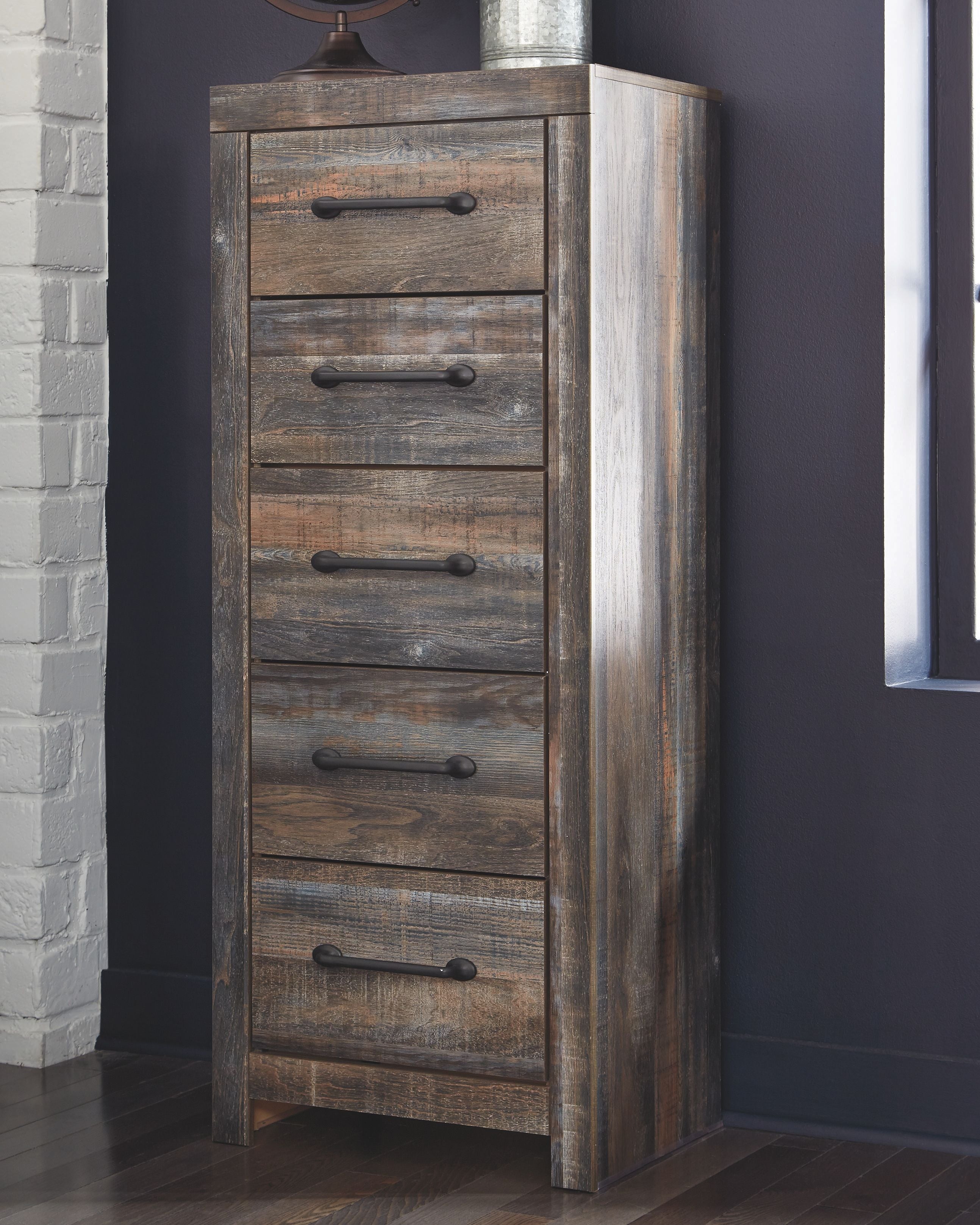 Tall narrow distressed wooden chest of drawers in brown with five drawers and black pulls