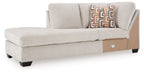Stone fabric corner chaise sofa with two back cushions and patterned accent pillow