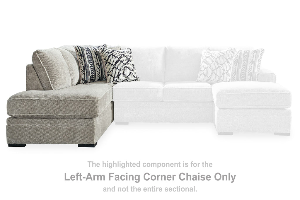 Gray left-arm corner chaise with patterned throw pillows in sectional layout