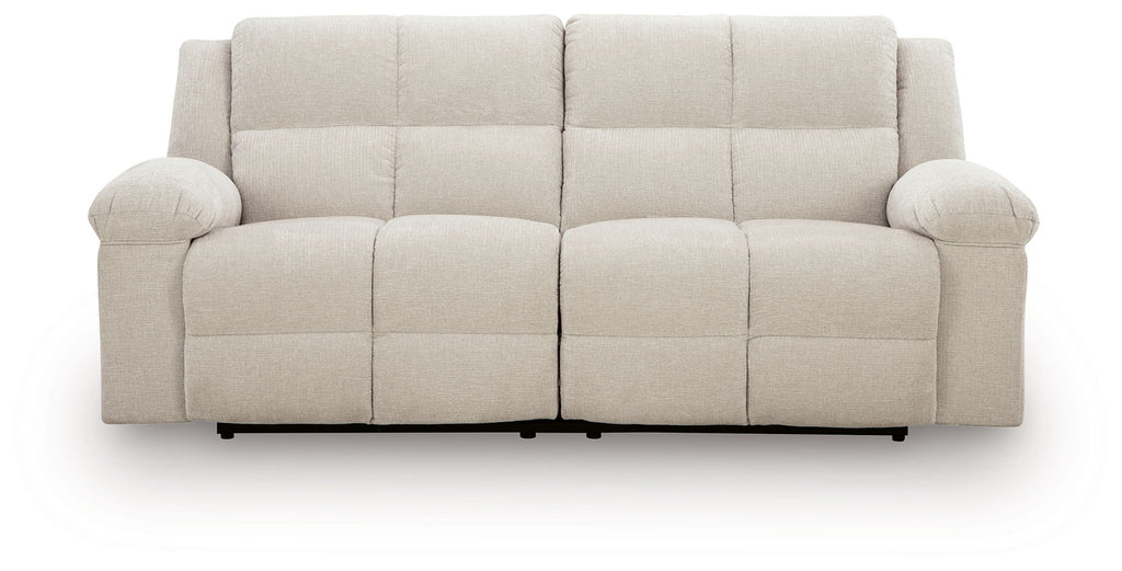Light beige 2-seat reclining sofa with button-tufted seat cushions and rounded arms