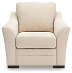 Beige upholstered recliner chair with padded back, seat, and low black base feet