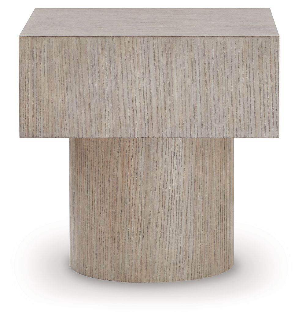 Light brown square table with flat top and cylindrical pedestal base