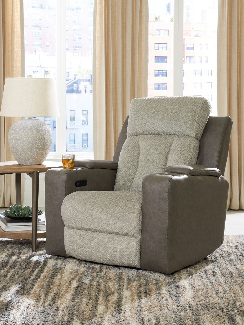 Fabric power recliner with adjustable headrest, beige seat and back, gray armrests.