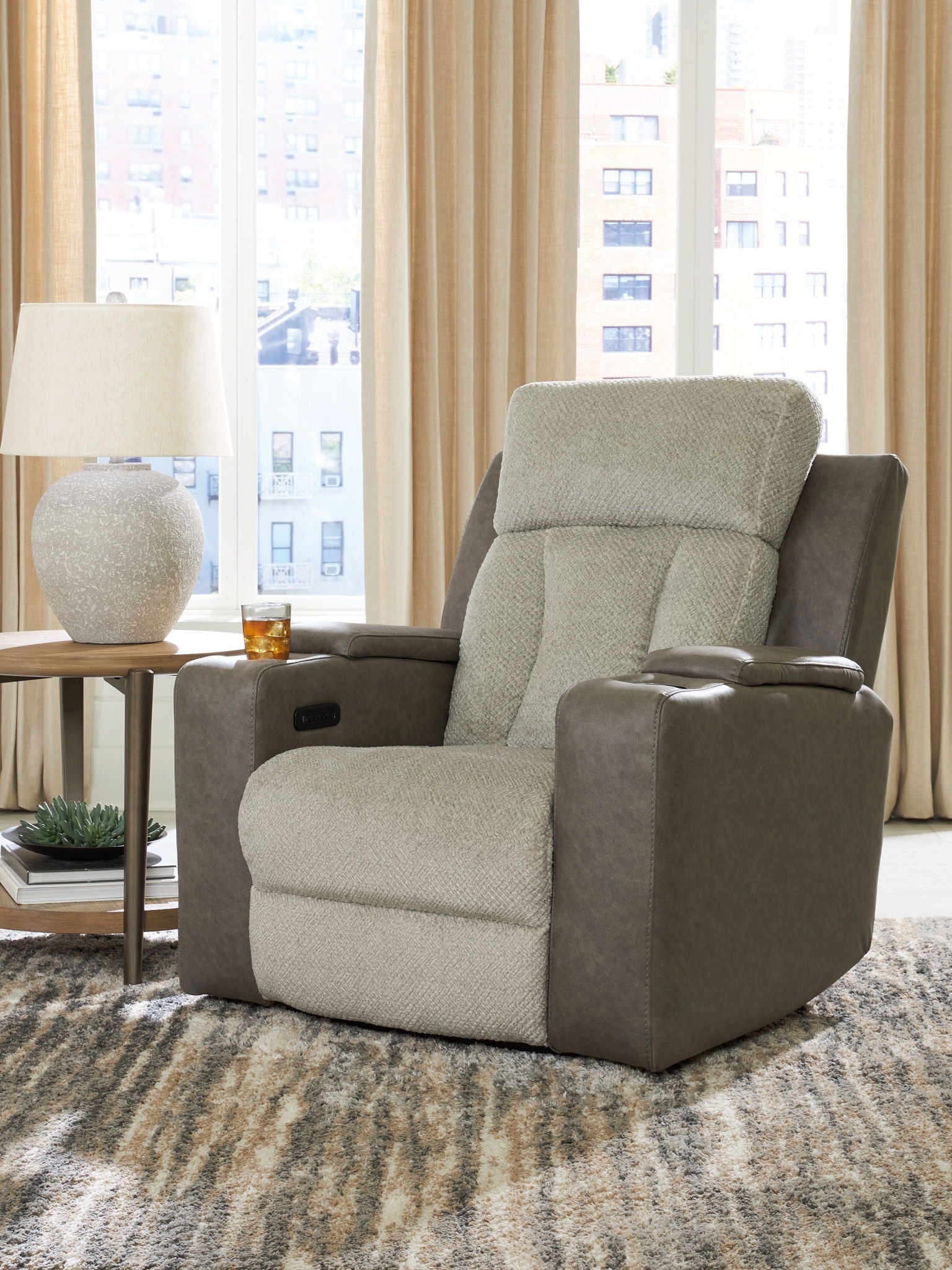 Fabric power recliner with adjustable headrest, beige seat and back, gray armrests.