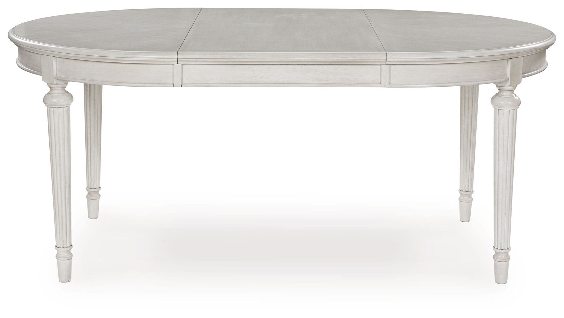 Antique white oval dining extension table shown from the side with center seam