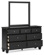 Black dresser with mirror and three drawer tiers, silver knobs, four turned legs