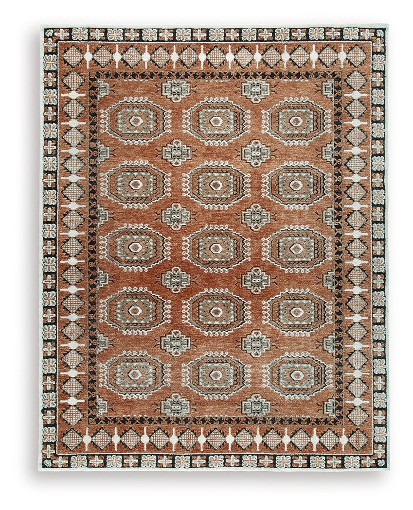 Brown area rug with geometric medallion pattern and decorative border, distressed look.