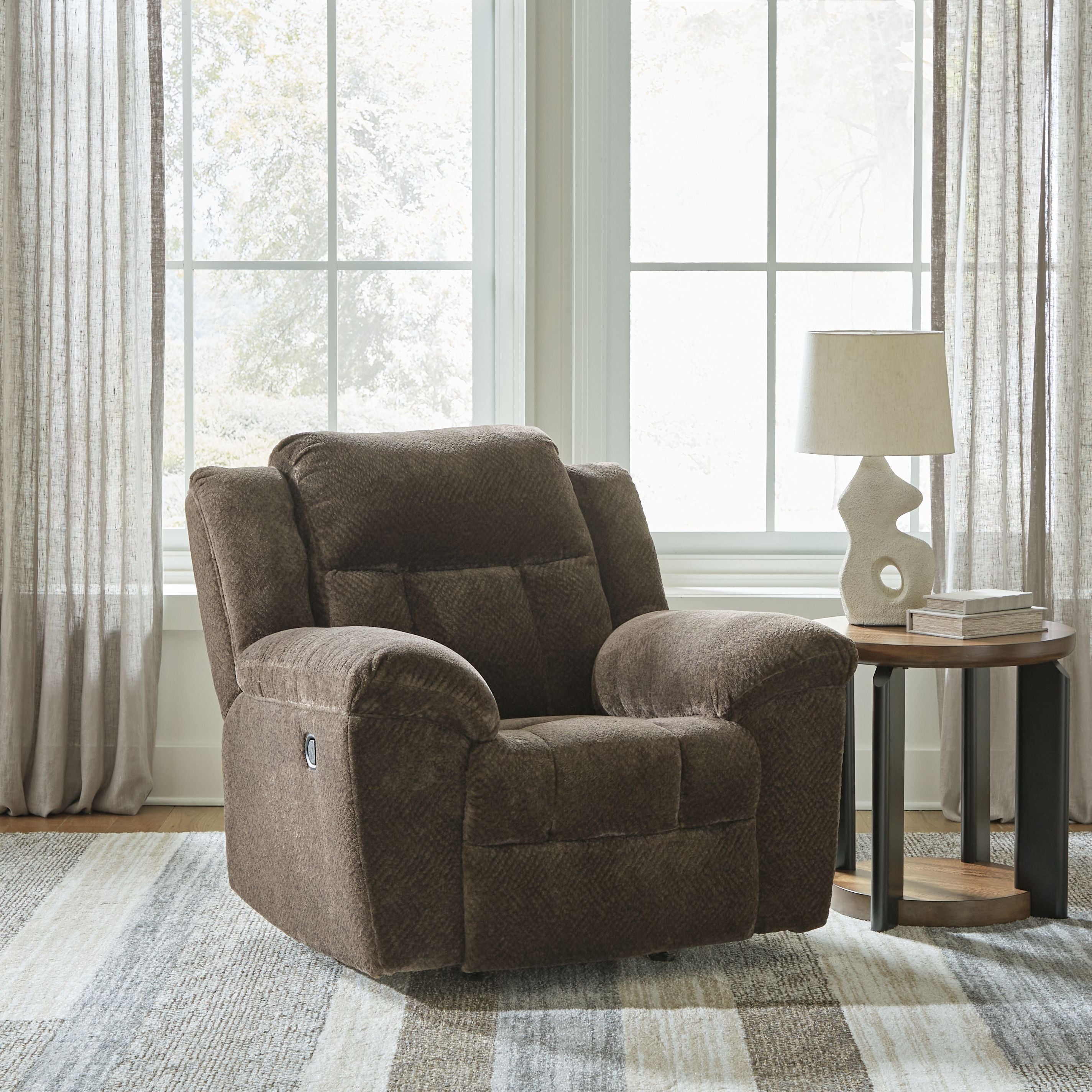 Chocolate fabric rocker recliner chair with tufted back and extended footrest