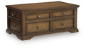 Dark brown wood table with four front drawers and metal pulls