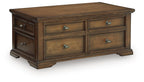 Dark brown wood table with four front drawers and metal pulls
