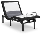 Black reclining bed base with raised headrest and fabric panels, front lift mechanism