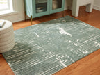Light blue abstract area rug with distressed horizontal streaks, rectangular shape