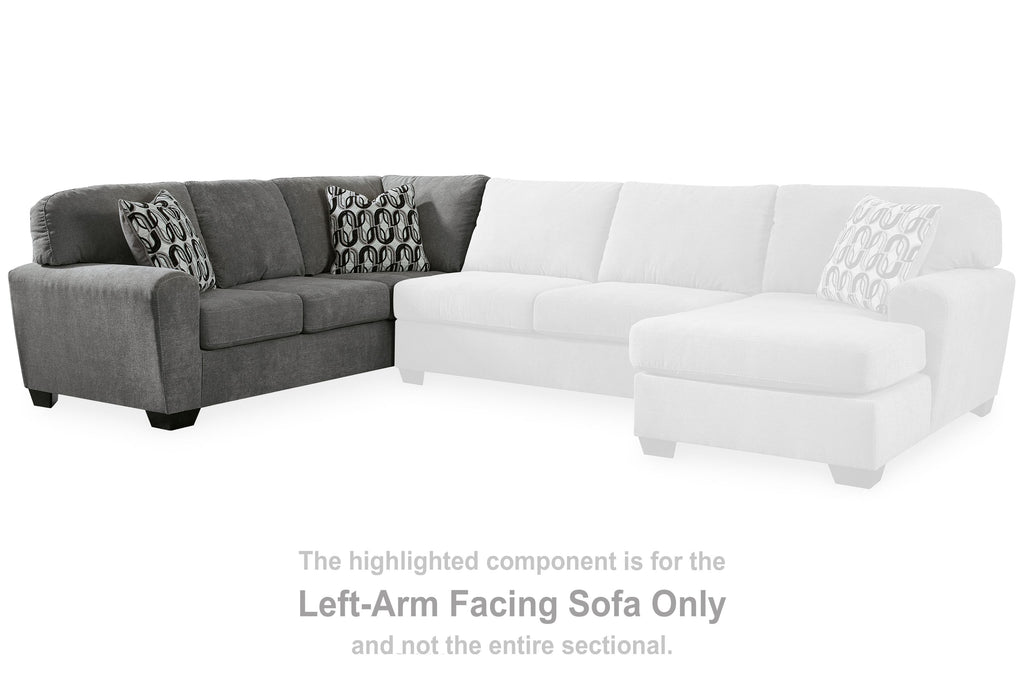 Gray left-arm facing sectional with white corner wedge and two patterned throw pillows