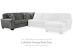 Gray left-arm facing sectional with white corner wedge and two patterned throw pillows