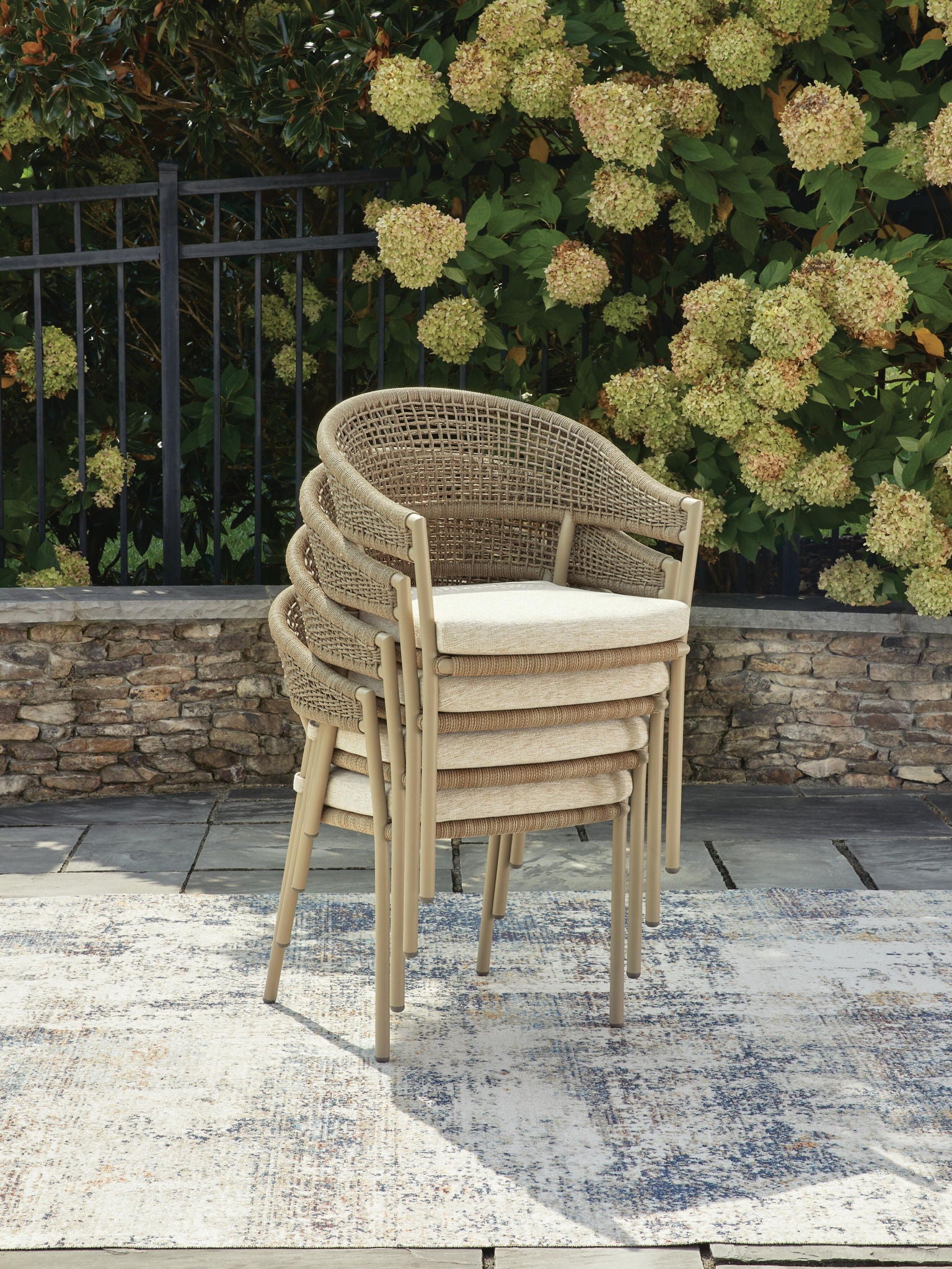 Beige woven arm chair with cushioned seat and armrests, set of 4.
