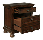 Dark brown two-drawer night stand with one drawer open and round metal pulls