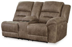 Power reclining loveseat with console, dark taupe fabric, angled view with wide armrests