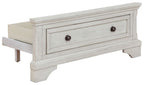 Antique white twin storage footboard with two drawers and round dark knobs