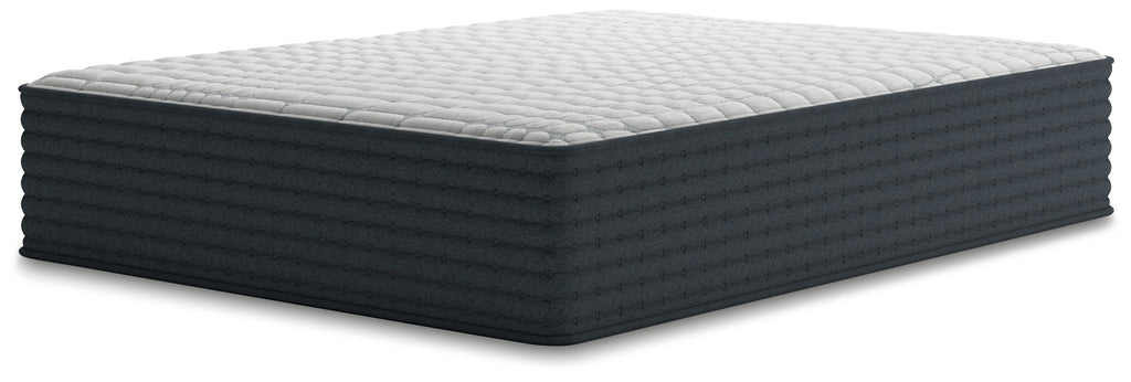 Hybrid mattress with white quilted top and dark gray base, side view