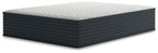 Hybrid mattress with white quilted top and dark gray base, side view