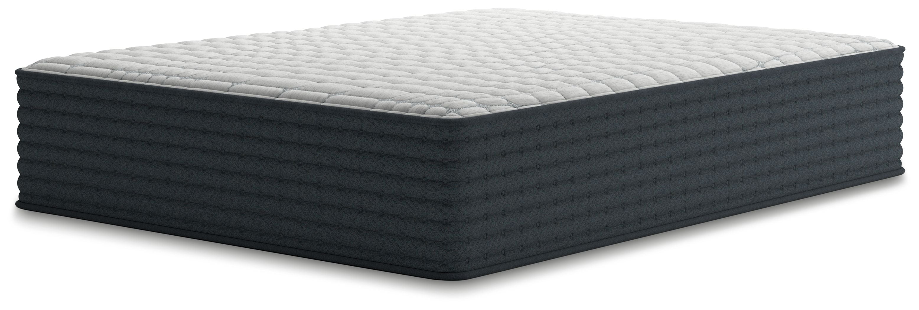Hybrid mattress with white quilted top and dark gray base, side view
