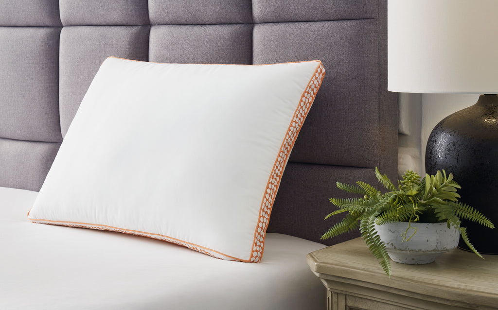 3-in-1 pillow with orange patterned border and thin piping