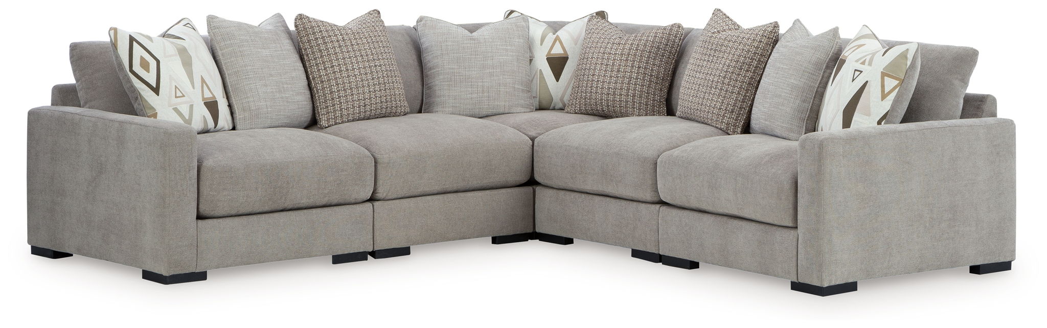 Gray sectional sofa with chaise corner and patterned throw pillows, side view