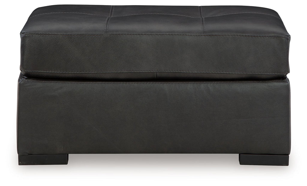 Oversized accent ottoman in dark gray with smooth sides and seam-lined top