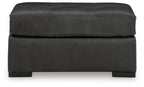 Oversized accent ottoman in dark gray with smooth sides and seam-lined top