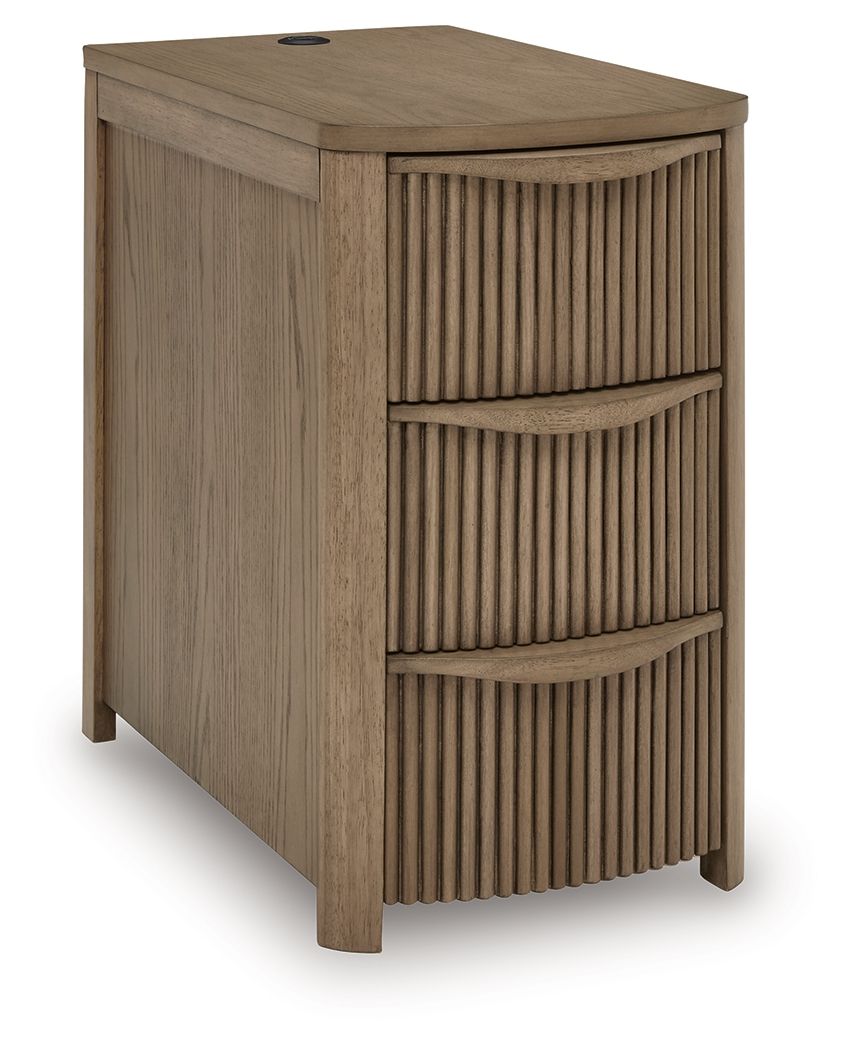 Light brown chair side end table with vertical slat doors and three open drawer compartments