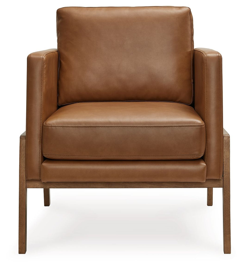 Caramel leather-look accent chair with wide arms, thick seat, and straight wooden legs