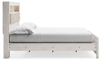 White bookcase bed with open side shelves and two drawers at foot