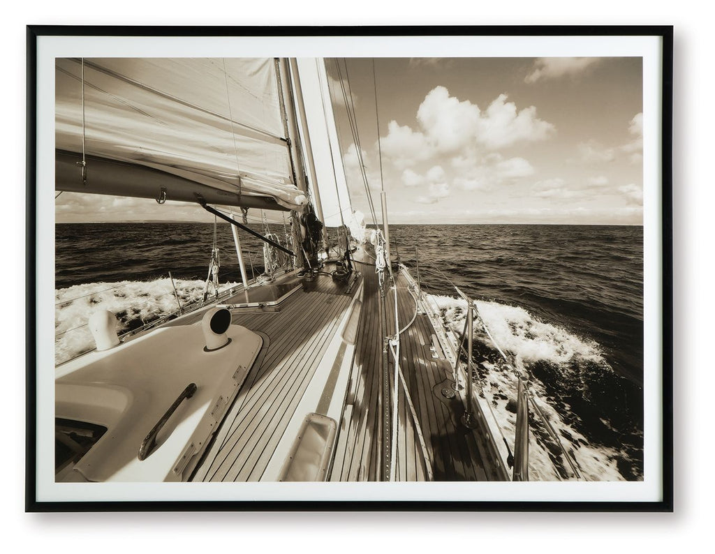 Sepia sailboat wall art print in a dark frame, deck and ocean view