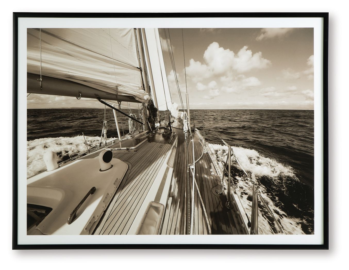 Sepia sailboat wall art print in a dark frame, deck and ocean view