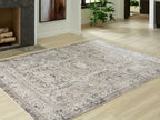 Geometric rug with distressed medallion pattern in light gray on off-white field