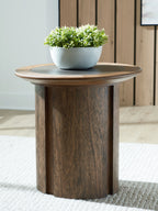 Dontayne round table with dark top and dark brown wood pedestal base with plant on top.