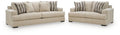 Oatmeal fabric sofa and loveseat set with striped throw pillows