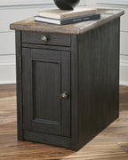 Dark gray cabinet end table with drawer, paneled door, and metal knobs
