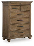 Medium brown wooden chest of drawers with seven drawers and metal bar handles