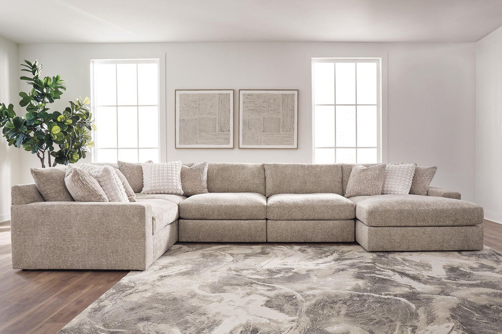 Burlap sectional sofa with corner and two chaise arms, textured upholstery.