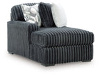 Gunmetal corduroy corner chaise with deep ridged cushions and two throw pillows