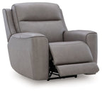 Gray power recliner with adjustable headrest, extended footrest.